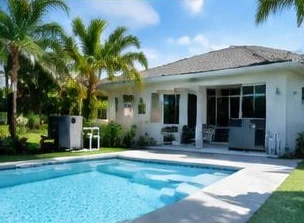 Heat pump pool heater hidden in a fenced side yard between a stucco wall and wooden fence