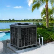 Heat pump pool heater hidden in a fenced side yard between a stucco wall and wooden fence
