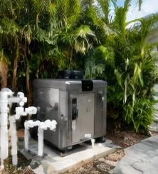 Pool heat pump installed beside a South Florida home — Pool heaters in North Palm Beach