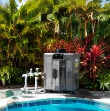 Pool heat pump installed beside a South Florida home — Pool Heater Installation in North Palm Beach