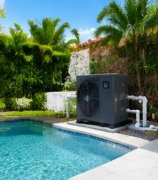 Heat pump pool heater hidden in a fenced side yard between a stucco wall and wooden fence
