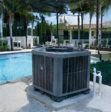 Pool heat pump installed beside a South Florida home — Pool Heater Installation in Delray Beach
