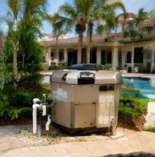 Heat pump pool heater hidden in a fenced side yard between a stucco wall and wooden fence