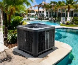 Heat pump pool heater hidden in a fenced side yard between a stucco wall and wooden fence