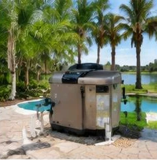 Pool heat pump installed beside a South Florida home — Pool Heater Installation in Wellington