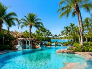 Pool heat pump installed beside a South Florida home — Pool Heater Replacement in Gulf Stream