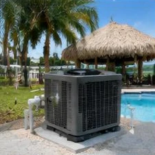 Pool heat pump installed beside a South Florida home — Pool Heater Installation in Lake Worth Beach