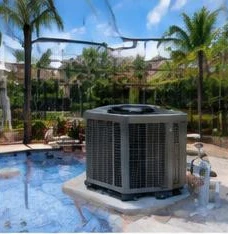 Heat pump pool heater hidden in a fenced side yard between a stucco wall and wooden fence