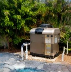 Pool heat pump installed beside a South Florida home — Pool Heater Repair in Wellington