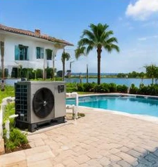 Heat pump pool heater hidden in a fenced side yard between a stucco wall and wooden fence