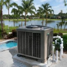 Heat pump pool heater hidden in a fenced side yard between a stucco wall and wooden fence