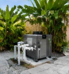 Heat pump pool heater hidden in a fenced side yard between a stucco wall and wooden fence