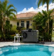 Heat pump pool heater hidden in a fenced side yard between a stucco wall and wooden fence