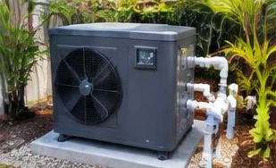 Heat pump pool heater hidden in a fenced side yard between a stucco wall and wooden fence