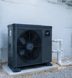 Heat pump pool heater hidden in a fenced side yard between a stucco wall and wooden fence